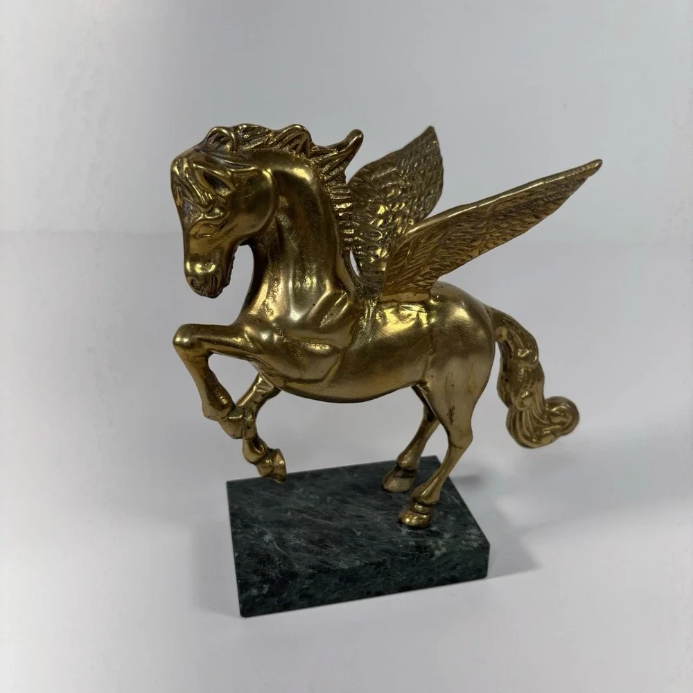 vintage solid brass Pegasus figurine mounted on a green marble base,
